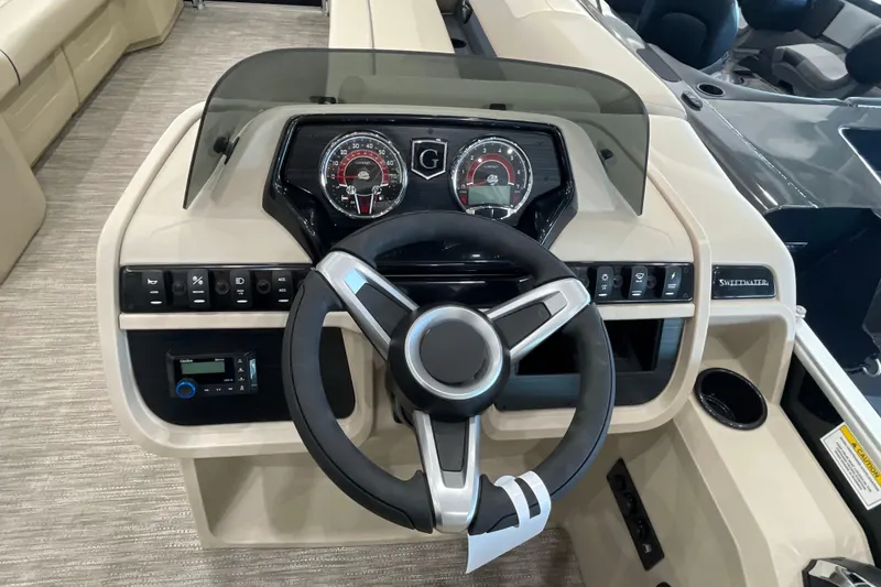 Slide: The Image of 2026 Godfrey Sweetwater 2286 C boat dashboard with steering wheel and control panel. - 10