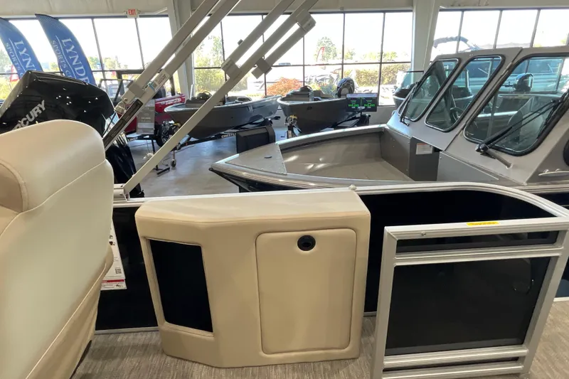 Slide: The Image of 2026 Godfrey Sweetwater 2286 C interior view in showroom with other boats. - 16