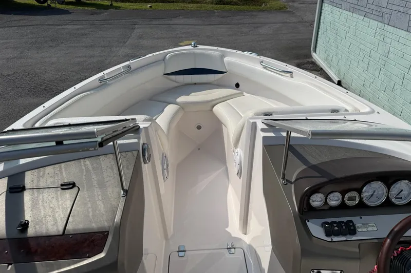 Slide: The Image of 2006 Regal 2000 Bowrider boat interior with seating and dashboard view. - 9