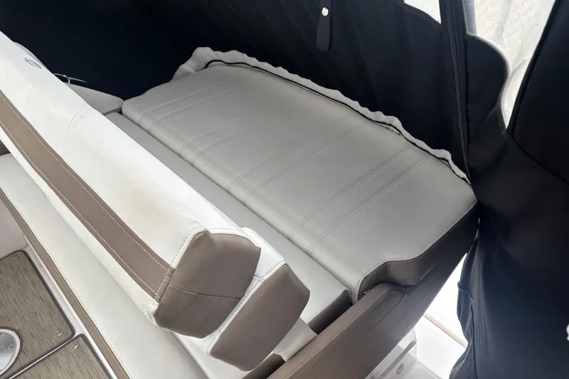 Slide: The Image of 2016 Regal 28 Express boat interior with cushioned seating and sleek design. - 3