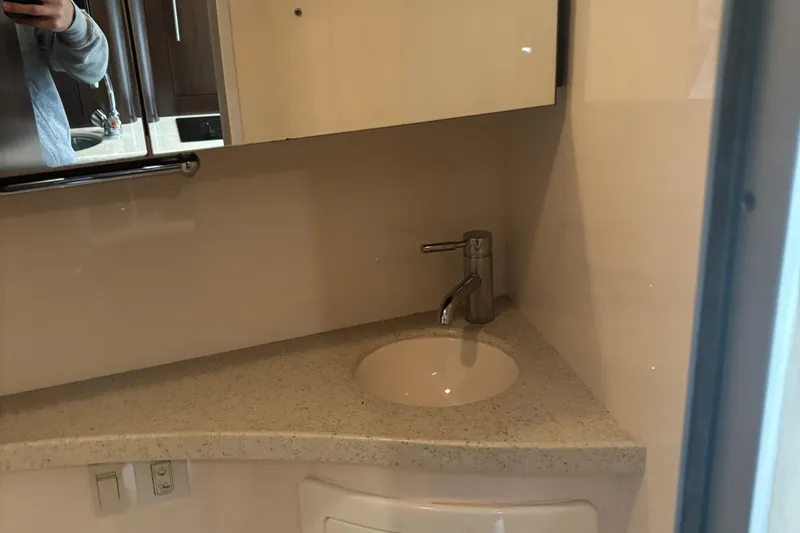 Slide: The Image of 2016 Regal 28 Express bathroom sink with modern faucet and countertop. - 8