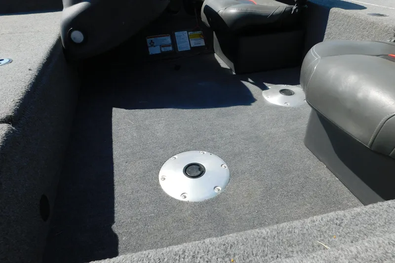 Slide: The Image of 2022 Tracker Pro Team 175 boat interior with gray carpet and seating. - 7