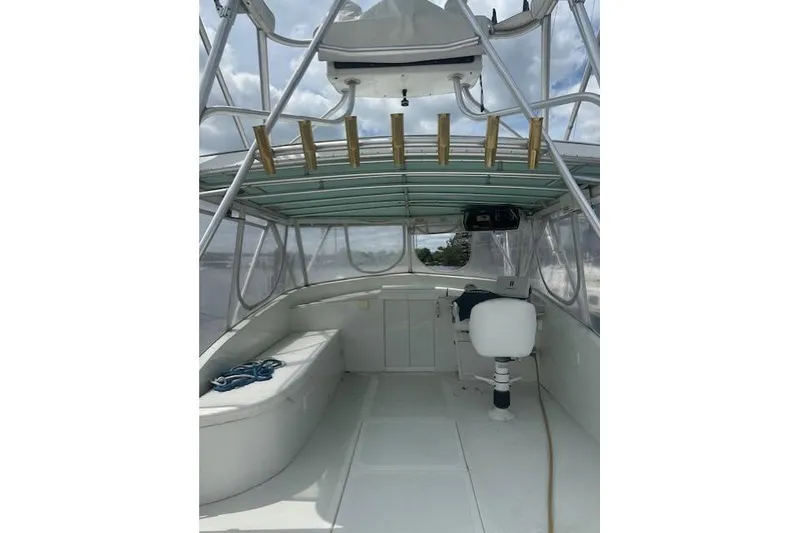 Slide: The Image of 2002 Bob Sherbert and Lou Rambo Custom Sportfish interior with seating and fishing rod holders. - 13