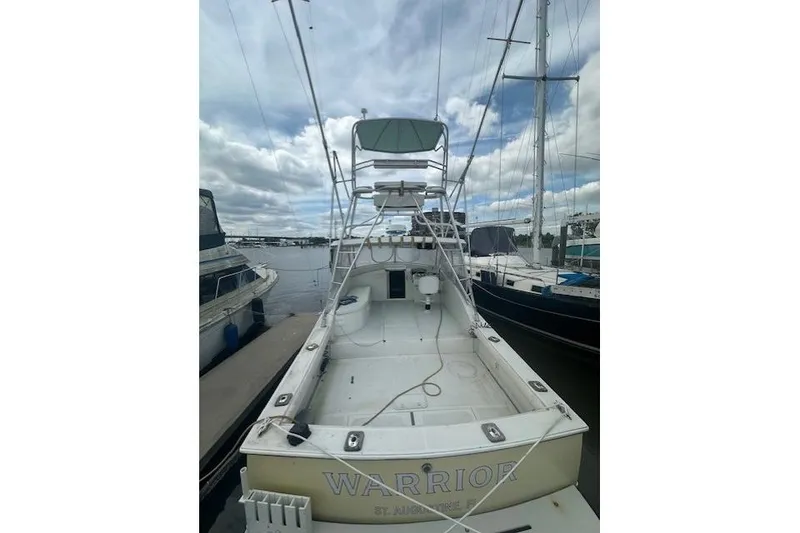 Slide: The Image of 2002 Bob Sherbert and Lou Rambo Custom Sportfish boat docked, view of deck and tower. - 2