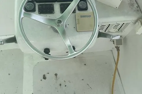 Slide: The Image of Steering wheel of a 2002 Bob Sherbert and Lou Rambo Custom Sportfish boat. - 3