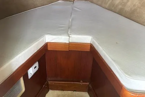 Slide: The Image of 2002 Bob Sherbert and Lou Rambo Custom Sportfish interior cabin with cushioned seating. - 4