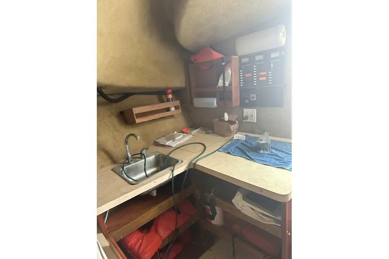 Slide: The Image of 2002 Bob Sherbert and Lou Rambo Custom Sportfish interior with sink and control panel. - 6
