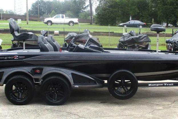 Slide: The Image of 2026 Ranger Z520R Cup-Equipped boat with sleek design and black finish on a trailer. - 5