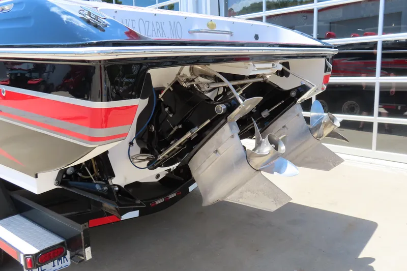 Slide: The Image of 2009 Donzi 35ZR boat with dual propellers, displayed on a trailer. - 11