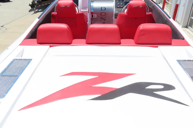 Slide: The Image of 2009 Donzi 35ZR boat with red seats and ZR logo on deck. - 13