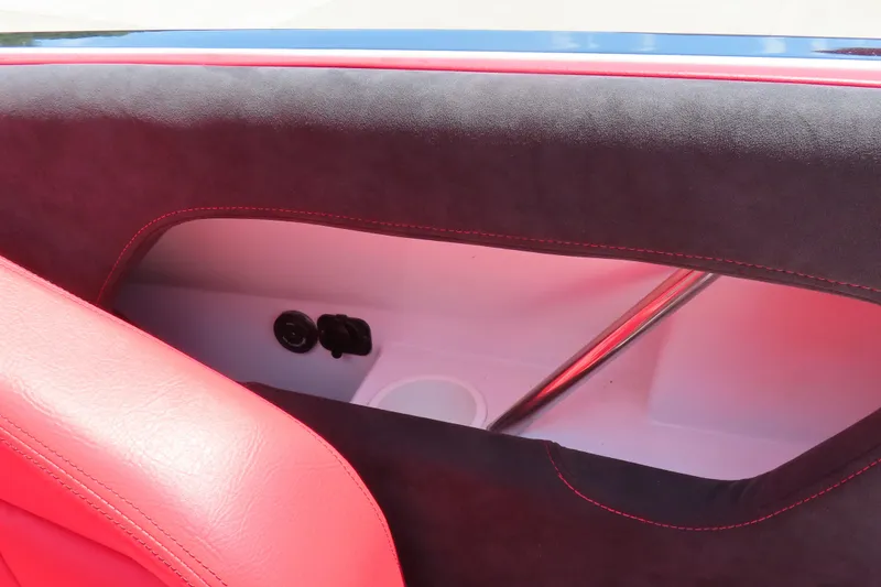 Slide: The Image of 2009 Donzi 35ZR interior detail with red and black upholstery, showcasing sleek design elements. - 24