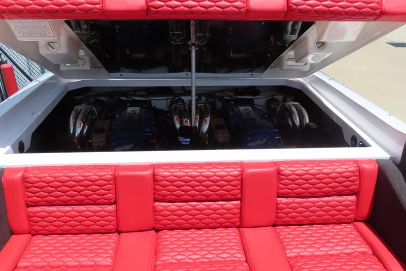 Slide: The Image of 2009 Donzi 35ZR boat engine compartment with red quilted seating. - 3