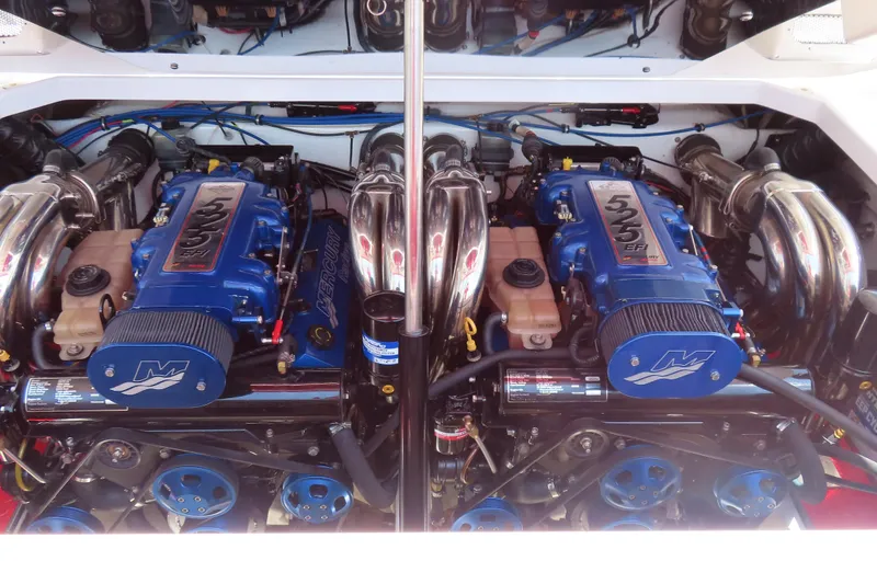 Slide: The Image of Twin Mercury engines in a 2009 Donzi 35ZR boat, showcasing high-performance power. - 4