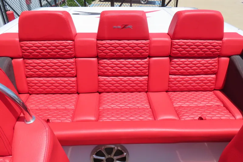 Slide: The Image of Red quilted seats in a 2009 Donzi 35ZR boat interior. - 9