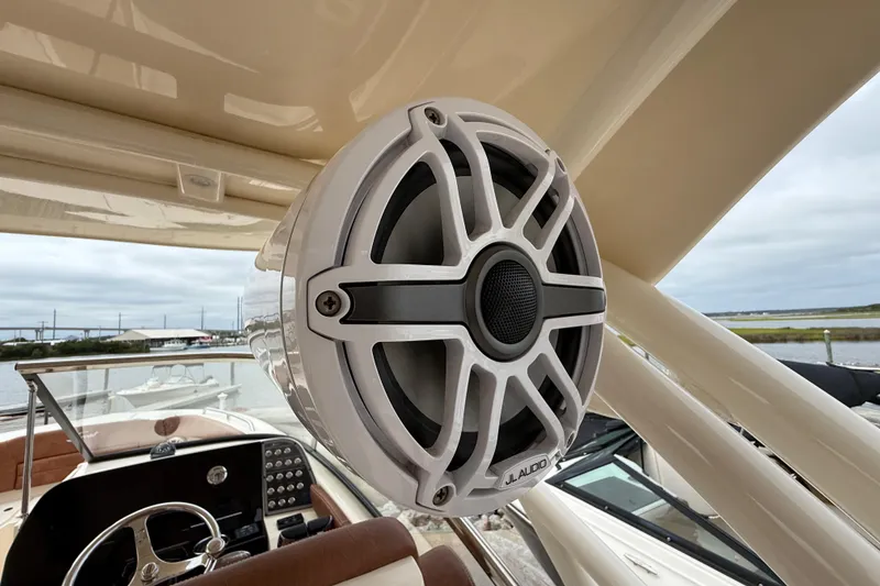 Slide: The Image of 2023 Scout 255 Dorado boat with JL Audio speaker, showcasing luxury marine audio system. - 33