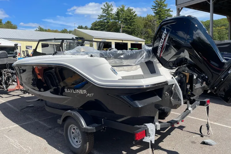 Slide: The Image of 2026 Bayliner Element E17 boat on trailer with Mercury engine, outdoors. - 5