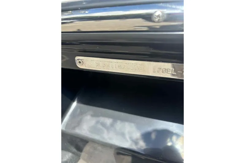 Slide: The Image of 2026 Bayliner Element E17 identification plate on a sleek black surface. - 9