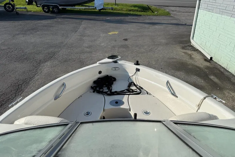 Slide: The Image of Bow view of a 2013 Tahoe Q5 boat parked on pavement. - 7