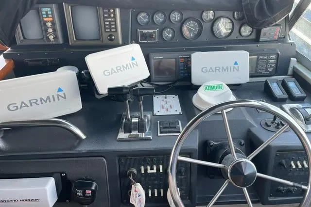 Slide: The Image of Control panel of 1989 Sea Ray 390 Express Cruiser with Garmin navigation systems. - 6