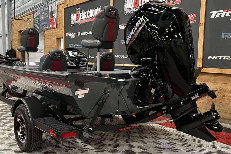 Slide: The Image of 2026 Ranger RT178 boat with Mercury engine in showroom setting. - 3