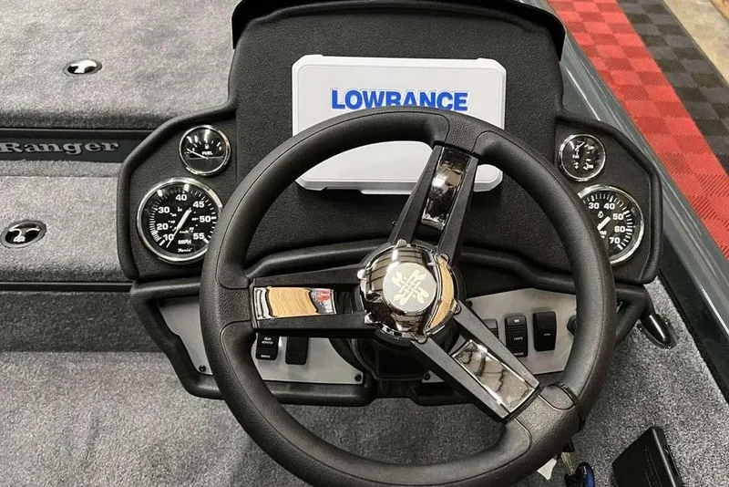 Slide: The Image of 2026 Ranger RT178 boat dashboard with steering wheel and Lowrance display. - 6