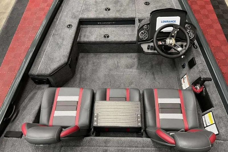 Slide: The Image of 2026 Ranger RT178 boat interior with dual seats, steering console, and red accents. - 7