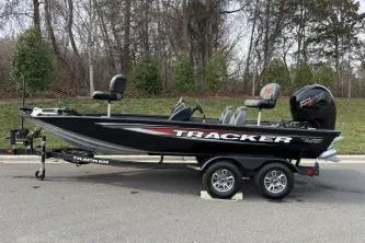 The Image of 2026 Tracker Pro Team 195 boat on trailer, parked outdoors. - 0