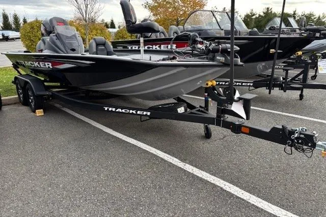 The Image of 2026 Tracker Pro Team 195 boat on trailer in parking lot. - 0