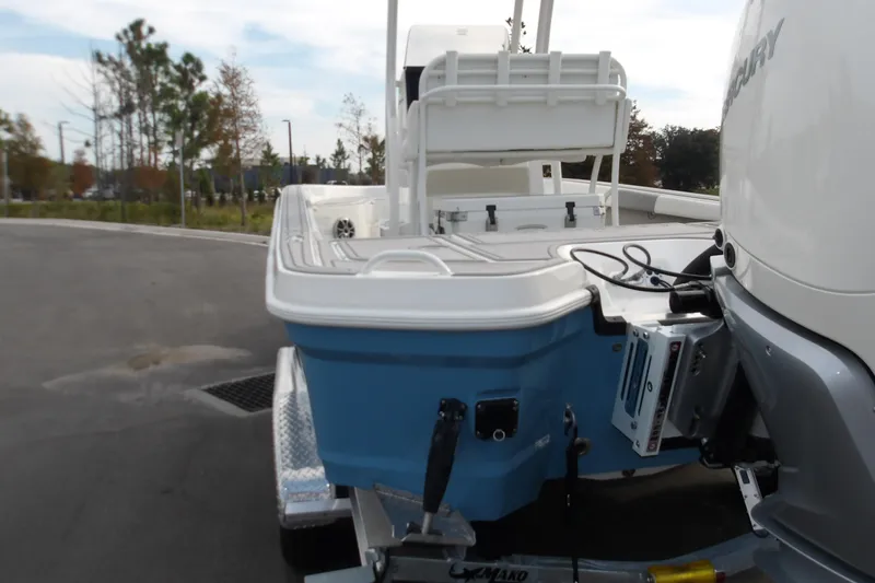 Slide: The Image of 2026 Mako 24 APEX boat on trailer, featuring blue hull and Mercury engine. - 3