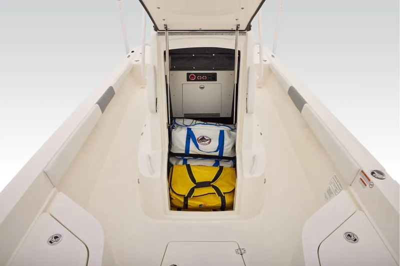 Slide: The Image of 2026 Mako 24 APEX boat interior with sleek seating and storage compartments. - 39