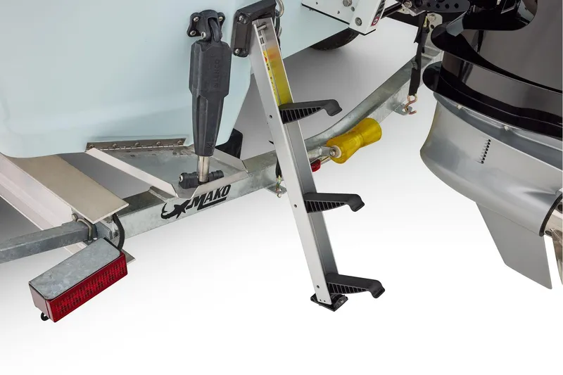 Slide: The Image of 2026 Mako 24 APEX boat trailer detail with stabilizer and red reflector. - 72