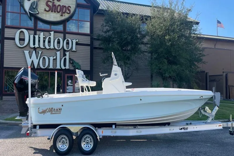 Slide: The Image of 2026 Mako 24 APEX boat deck with storage compartments and seating. - 4