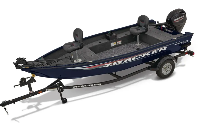 The Image of 2026 Tracker Super Guide V-16 T boat on trailer, parked against a beige wall. - 0