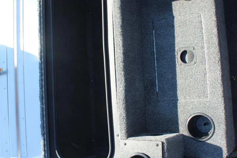 Slide: The Image of Interior view of 2026 Tracker Pro Team 195 boat storage compartment. - 14