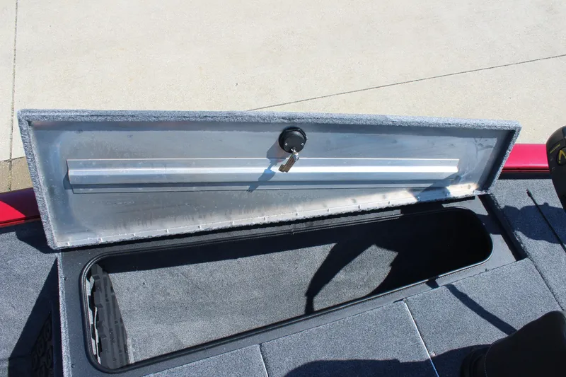 Slide: The Image of Open storage compartment on 2026 Tracker Pro Team 195 boat, showing interior space. - 18