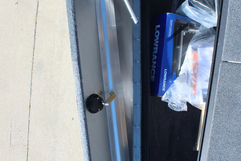 Slide: The Image of 2026 Tracker Pro Team 195 boat storage with Lowrance equipment and accessories. - 19