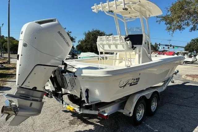Slide: The Image of 2026 Mako 24 APEX boat on trailer, showcasing sleek hull design. - 10