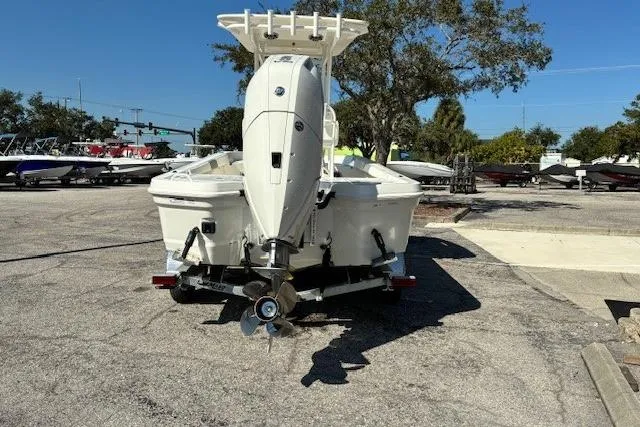 Slide: The Image of 2026 Mako 24 APEX boat deck with storage compartments and seating. - 11