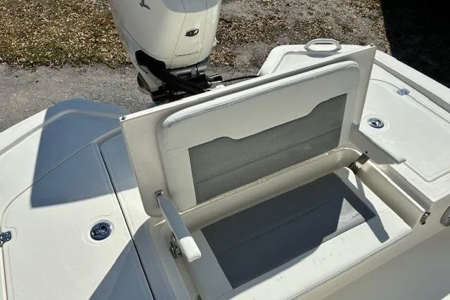 Slide: The Image of Top view of 2026 Mako 24 APEX boat with illuminated deck and outboard motor. - 8