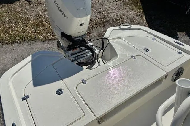 Slide: The Image of 2026 Mako 24 APEX boat with Mercury outboard engine, featuring spacious deck layout. - 9