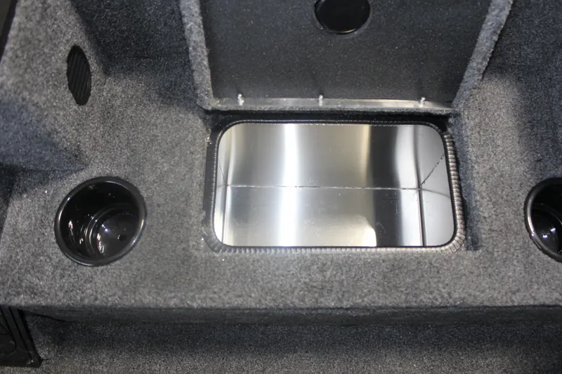 Slide: The Image of 2026 Tracker Pro Team 195 boat interior storage compartment with cup holders. - 17