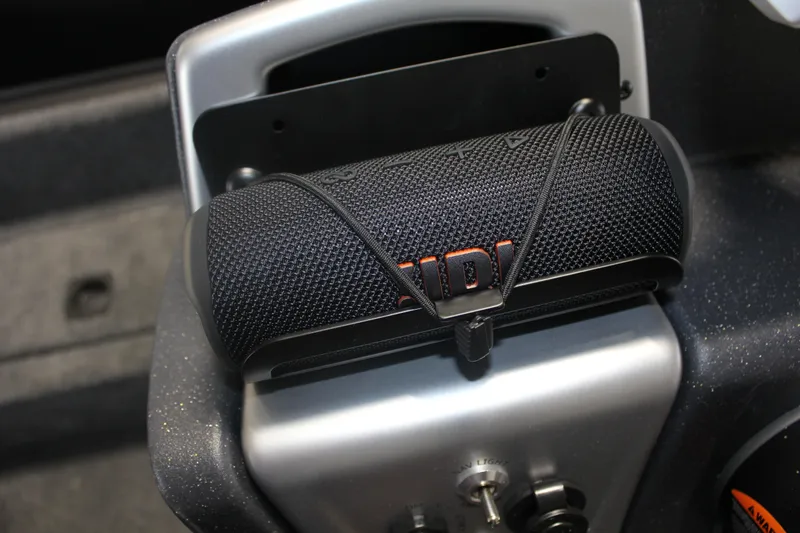 Slide: The Image of Black speaker secured on 2026 Tracker Pro Team 195 boat console. - 18