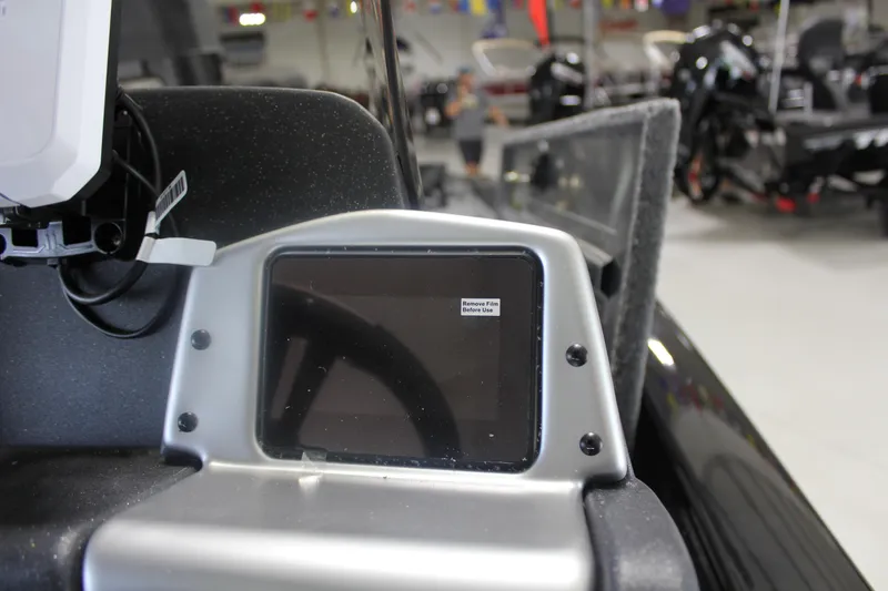 Slide: The Image of 2026 Tracker Pro Team 195 dashboard with protective film on display screen. - 21