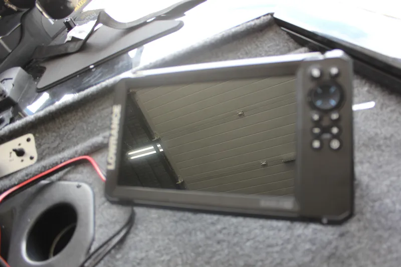 Slide: The Image of Fishfinder device on 2026 Tracker Pro Team 195 boat dashboard. - 5