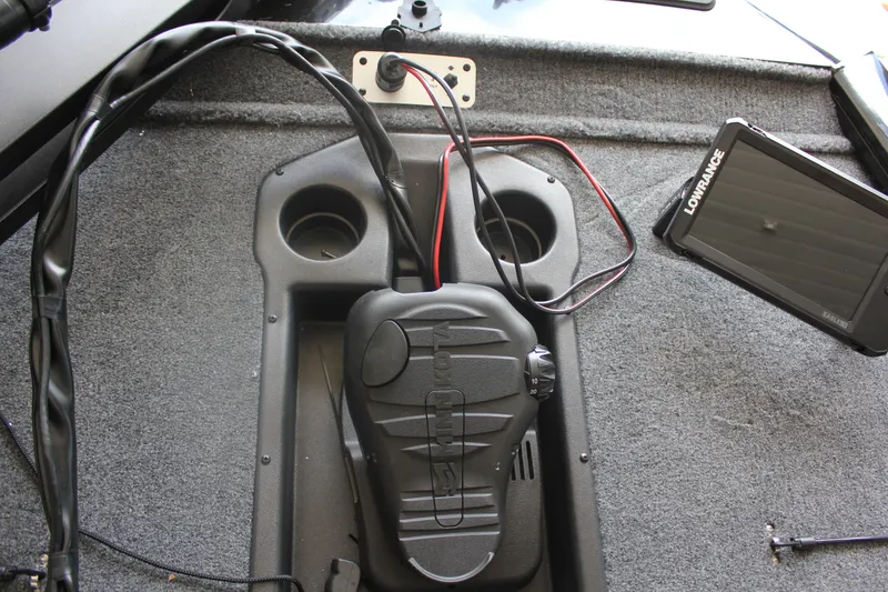 Slide: The Image of 2026 Tracker Pro Team 195 boat interior with foot pedal and Lowrance fishfinder. - 6