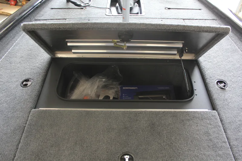 Slide: The Image of Open storage compartment in 2026 Tracker Pro Team 195 boat, showing interior space. - 9