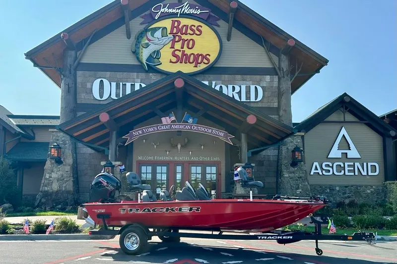 The Image of 2026 Tracker Pro Team 195 boat displayed outside Bass Pro Shops store. - 0