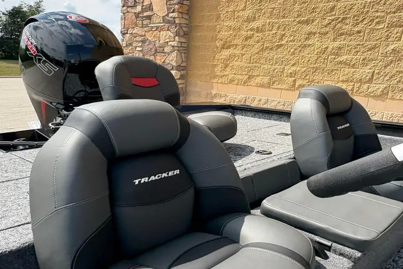 Slide: The Image of 2026 Tracker Pro Team 195 boat interior with gray seats and powerful engine. - 5