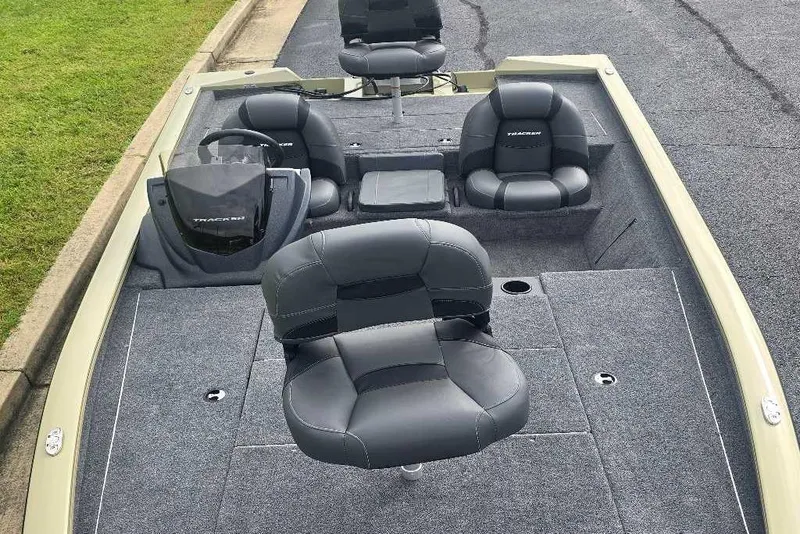 Slide: The Image of 2026 Tracker Pro Team 195 boat interior with gray seating and carpeted deck. - 5