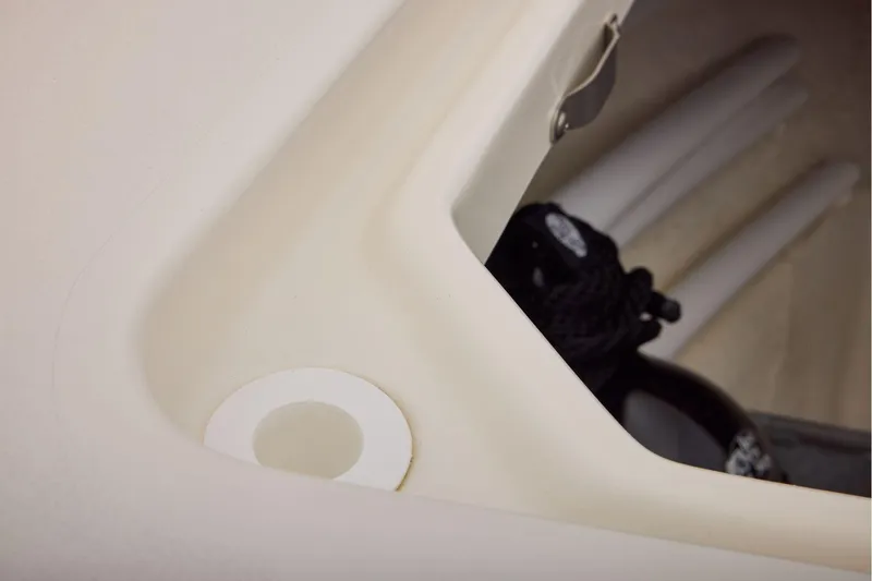 Slide: The Image of Storage compartment in 2026 Mako 24 APEX boat with ropes and accessories. - 13